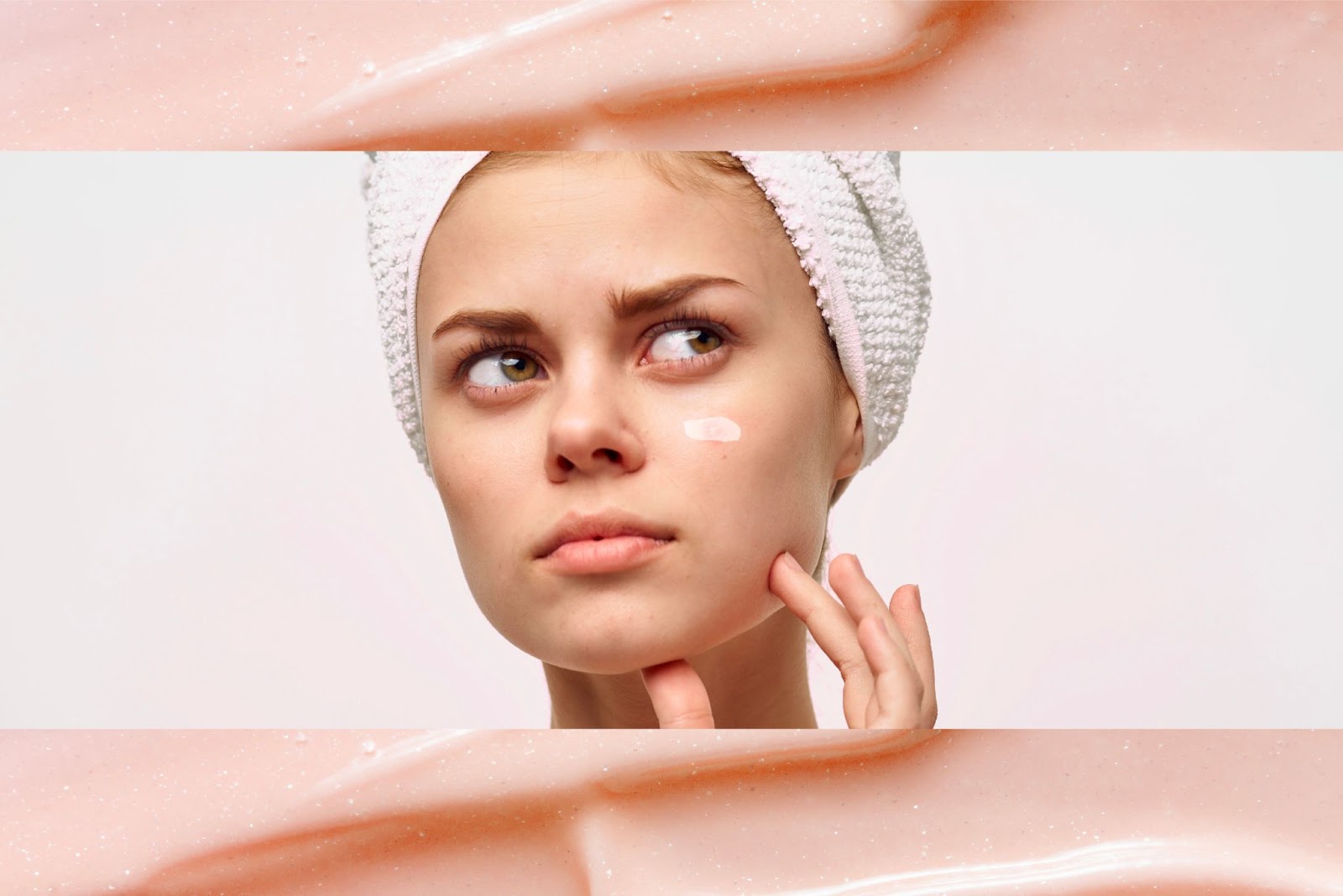 A puzzled looking woman applying toothpaste to her face.