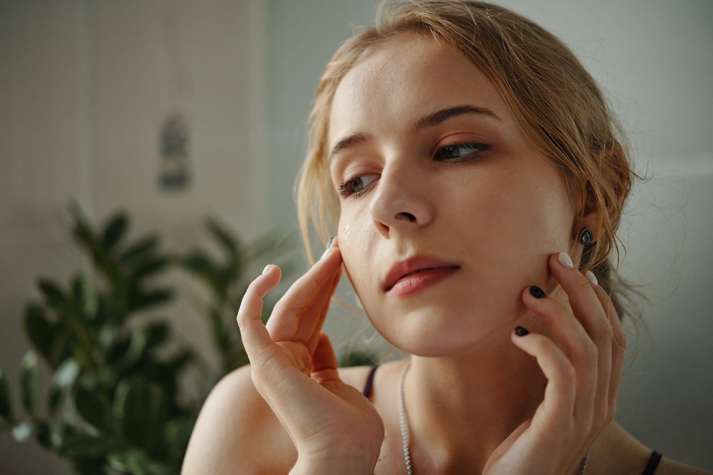 Woman touching her face