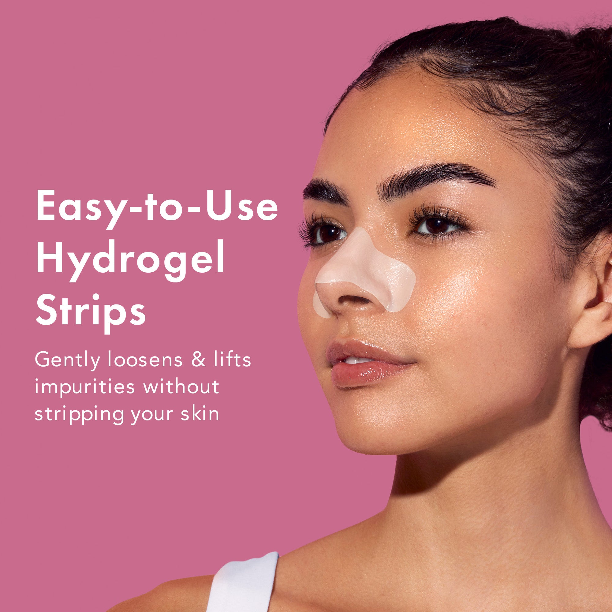Woman with a hydrogel strip on her face against a pink background